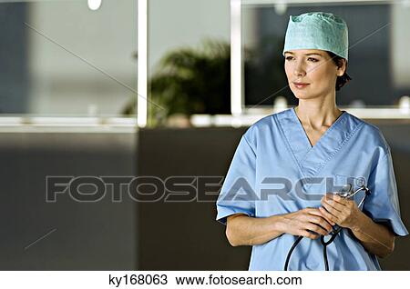 Female doctor holding a stethoscope View Large Photo Image Stock Image - Female doctor holding a stethoscope. Fotosearch