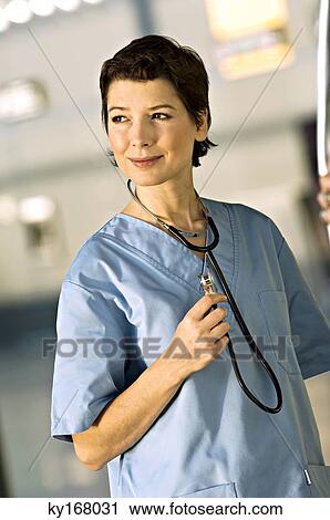Female doctor smiling View Large Photo Image Stock Image - Female doctor smiling. Fotosearch