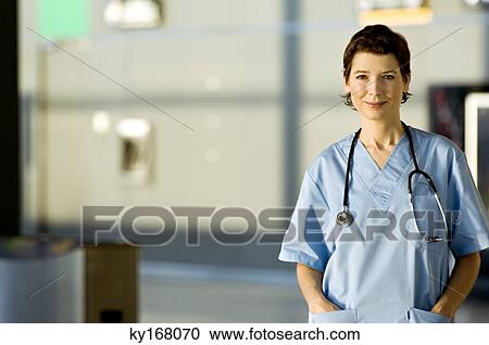 Portrait of a female doctor smiling View Large Photo Image Stock Image - Portrait of a female doctor smiling. Fotosearch