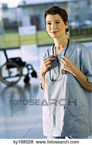 Portrait of a female doctor smiling View Large Photo Image Stock Photo - Portrait of a female doctor smiling. Fotosearch