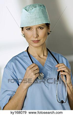 Stock Photo - Portrait of a female doctor with a stethoscope around her neck. Fotosearch