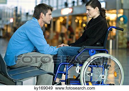 Side profile of a mid adult man talking with a young woman View Large Photo Image Stock Photo - Side profile of a mid adult man talking with a young woman. Fotosearch