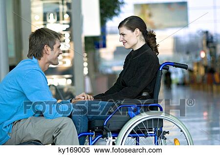 Side profile of a mid adult man talking with a young woman View Large Photo Image Stock Photography - Side profile of a mid adult man talking with a young woman. Fotosearch