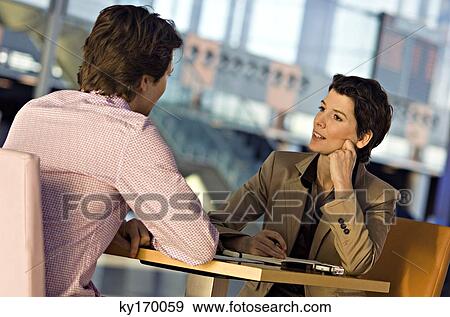 Businessman and a businesswoman in a meeting View Large Photo Image Stock Photo - Businessman and a businesswoman in a meeting. Fotosearch
