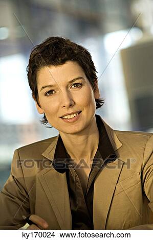Portrait of a businesswoman smiling View Large Photo Image Picture - Portrait of a businesswoman smiling. Fotosearch