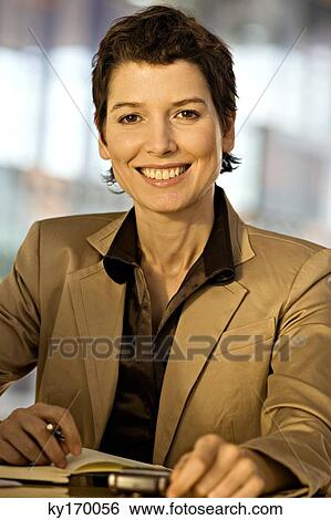 Portrait of a businesswoman smiling View Large Photo Image Stock Photograph - Portrait of a businesswoman smiling. Fotosearch
