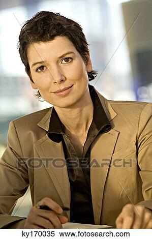 Portrait of a businesswoman smiling View Large Photo Image Stock Photography - Portrait of a businesswoman smiling. Fotosearch