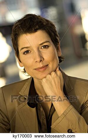 Portrait of a businesswoman thinking with her hand on her chin View Large Photo Image Stock Image - Portrait of a businesswoman thinking with her hand on her chin. Fotosearch