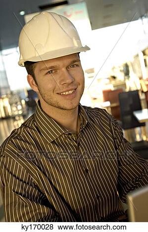 Portrait of a male architect smiling View Large Photo Image Stock Photo - Portrait of a male architect smiling. Fotosearch
