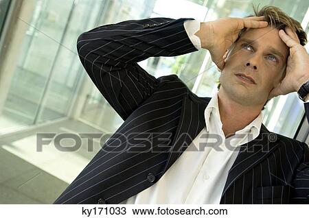 Close-up of a businessman looking serious View Large Photo Image Stock Image - Close-up of a businessman looking serious. Fotosearch