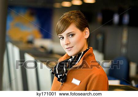 Portrait of a female airline check-in attendant View Large Photo Image Stock Image - Portrait of a female airline check-in attendant. Fotosearch
