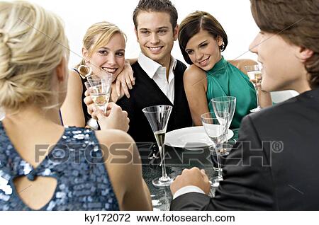 Five people enjoying a dinner party View Large Photo Image Stock Image - Five people enjoying a dinner party. Fotosearch