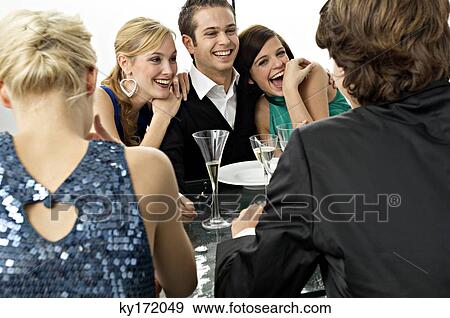 Five people enjoying a dinner party View Large Photo Image Stock Photo - Five people enjoying a dinner party. Fotosearch