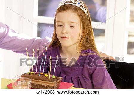 Stock Photo - Girl celebrating her birthday. Fotosearch