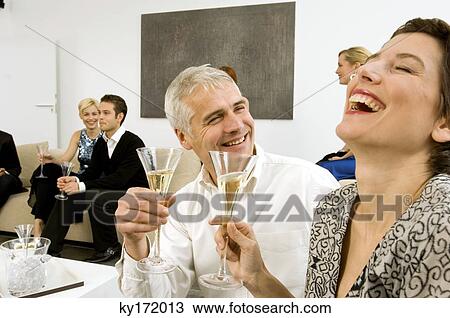 Group of people enjoying a party View Large Photo Image Stock Image - Group of people enjoying a party. Fotosearch