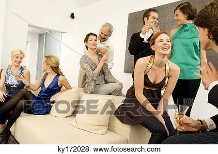 Group of people enjoying a party View Large Photo Image Stock Photo - Group of people enjoying a party. Fotosearch