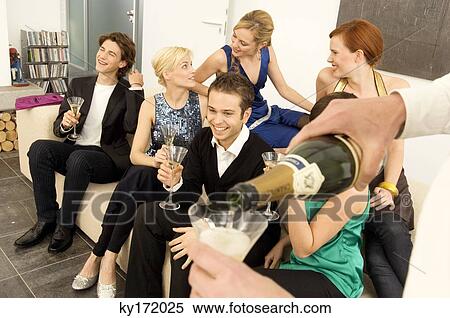 Group of people enjoying a party View Large Photo Image Stock Photography - Group of people enjoying a party. Fotosearch