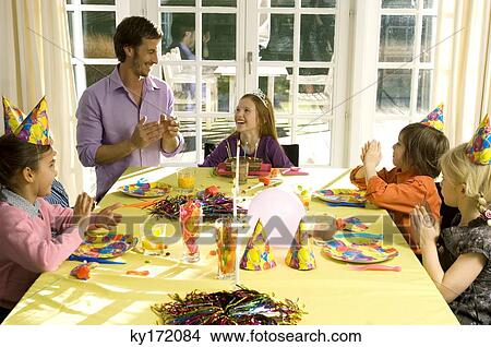 Picture - Group of people in a birthday party. Fotosearch
