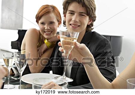 Portrait of a teenage boy with his friends at a dinner party View Large Photo Image Stock Photo - Portrait of a teenage boy with his friends at a dinner party. Fotosearch