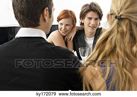 Portrait of a teenage boy with his friends at a dinner party View Large Photo Image Stock Photo - Portrait of a teenage boy with his friends at a dinner party. Fotosearch