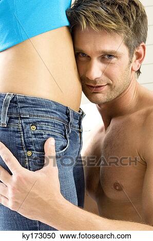 Portrait of a mid adult man embracing a young woman View Large Photo Image Stock Image - Portrait of a mid adult man embracing a young woman. Fotosearch