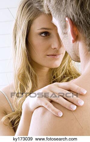 Young woman and a mid adult man romancing View Large Photo Image Stock Photo - Young woman and a mid adult man romancing. Fotosearch