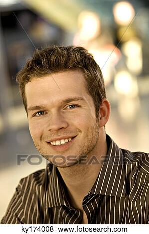 Portrait of a businessman smiling View Large Photo Image Stock Photo - Portrait of a businessman smiling. Fotosearch