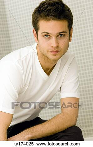 Portrait of a young man posing View Large Photo Image Stock Photography - Portrait of a young man posing. Fotosearch