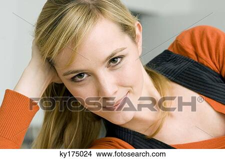 Portrait of a young woman smiling View Large Photo Image Picture - Portrait of a young woman smiling. Fotosearch