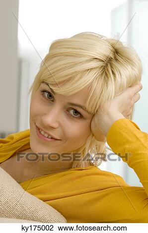 Portrait of a young woman smiling View Large Photo Image Stock Image - Portrait of a young woman smiling. Fotosearch
