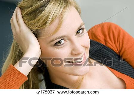 Portrait of a young woman smiling View Large Photo Image Stock Photo - Portrait of a young woman smiling. Fotosearch