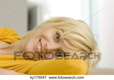 Portrait of a young woman smiling View Large Photo Image Stock Photo - Portrait of a young woman smiling. Fotosearch