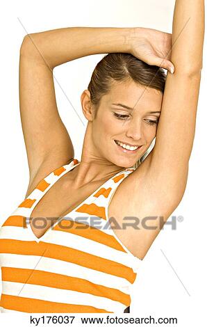 Close-up of a young woman stretching View Large Photo Image Stock Photo - Close-up of a young woman stretching. Fotosearch