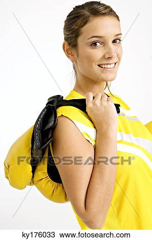 Portrait of a female boxer carrying boxing gloves on her shoulder and smiling View Large Photo Image Stock Image - Portrait of a female boxer carrying boxing gloves on her shoulder and smiling. Fotosearch