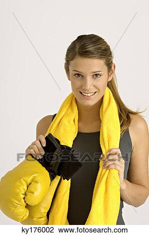 Portrait of a female boxer holding boxing gloves and smiling View Large Photo Image Stock Image - Portrait of a female boxer holding boxing gloves and smiling. Fotosearch