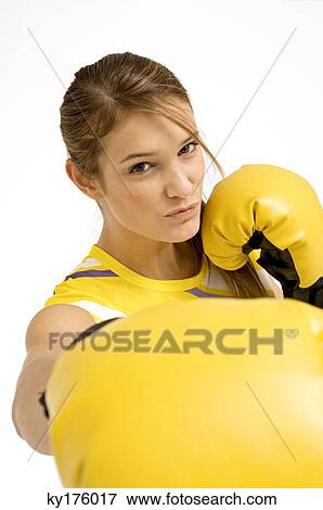Portrait of a female boxer in a boxing stance View Large Photo Image Stock Photo - Portrait of a female boxer in a boxing stance. Fotosearch