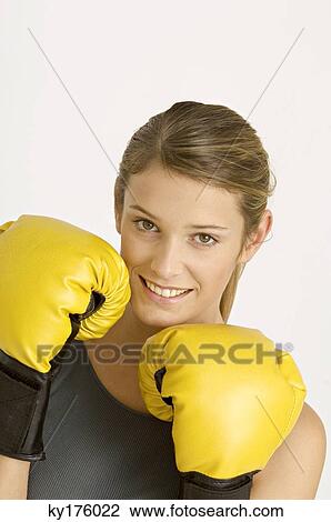 Portrait of a female boxer smiling View Large Photo Image Stock Image - Portrait of a female boxer smiling. Fotosearch