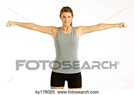 Portrait of a young woman exercising with dumbbells View Large Photo Image Stock Photography - Portrait of a young woman exercising with dumbbells. Fotosearch