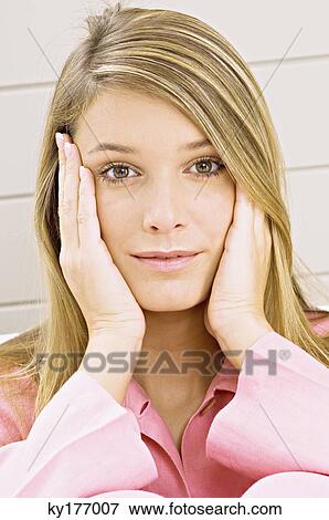Portrait of a young woman smiling View Large Photo Image Stock Photo - Portrait of a young woman smiling. Fotosearch