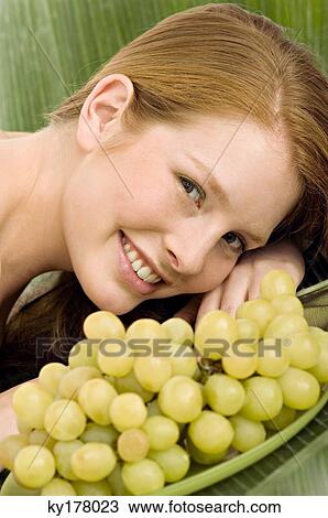 Portrait of a young woman lying on a massage table and smiling View Large Photo Image Stock Image - Portrait of a young woman lying on a massage table and smiling. Fotosearch