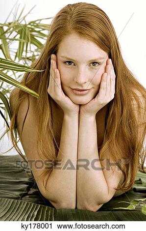 Portrait of a young woman lying on banana leaves View Large Photo Image Stock Image - Portrait of a young woman lying on banana leaves. Fotosearch