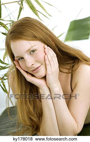 Portrait of a young woman lying on banana leaves View Large Photo Image Stock Photo - Portrait of a young woman lying on banana leaves. Fotosearch