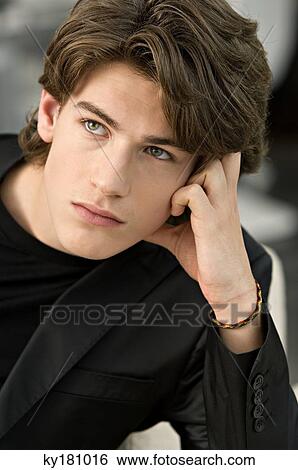 Close-up of a teenage boy looking up and thinking View Large Photo Image Stock Photograph - Close-up of a teenage boy looking up and thinking. Fotosearch