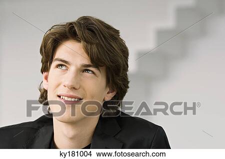 Close-up of a teenage boy smiling View Large Photo Image Picture - Close-up of a teenage boy smiling. Fotosearch