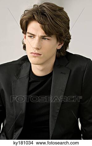 Close-up of a teenage boy thinking View Large Photo Image Picture - Close-up of a teenage boy thinking. Fotosearch