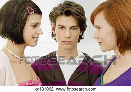Portrait of a teenage boy with two young women View Large Photo Image Stock Image - Portrait of a teenage boy with two young women. Fotosearch