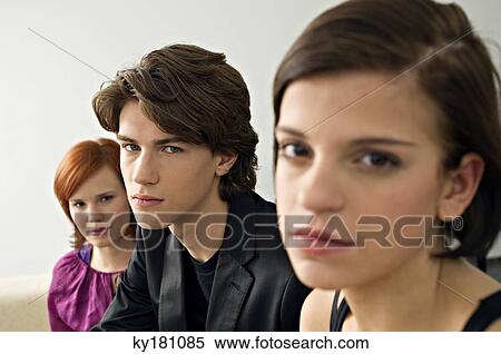 Portrait of a teenage boy with two young women View Large Photo Image Stock Photography - Portrait of a teenage boy with two young women. Fotosearch