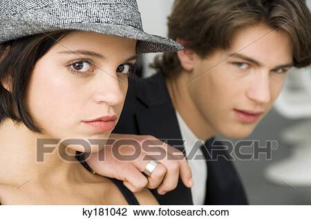 Portrait of a young woman and a teenage boy looking serious View Large Photo Image Stock Image - Portrait of a young woman and a teenage boy looking serious. Fotosearch
