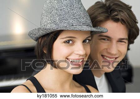 Portrait of a young woman smiling with a teenage boy View Large Photo Image Stock Photography - Portrait of a young woman smiling with a teenage boy. Fotosearch