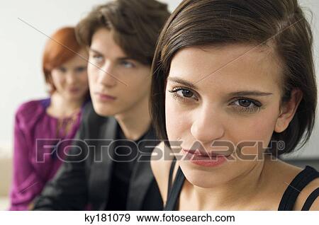 Portrait of a young woman smirking View Large Photo Image Stock Photo - Portrait of a young woman smirking. Fotosearch